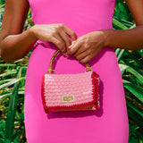 Elevate your style with the AIRMAIL Mini Crochet Handbag In Pink, perfect for casual outings and essentials.