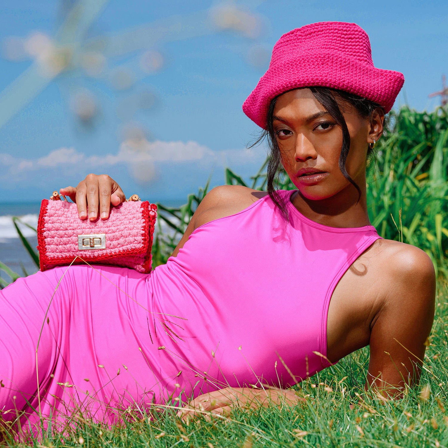 Stylishly showcase the AIRMAIL Mini Crochet Handbag In Pink, perfect for casual outings with a trendy duo-tone design.