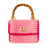 Stylish AIRMAIL Mini Crochet Handbag In Pink & Red, perfect for casual outings, featuring a bamboo handle.
