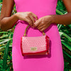 Elevate your style with the AIRMAIL Mini Crochet Handbag In Pink, perfect for casual outings and essentials.